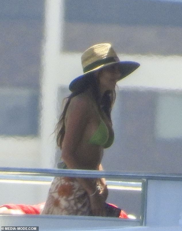 The $6.90 hat, which featured a green band with the Bunnings logo, was an unusually inexpensive item compared to her usually high-end designer wardrobe.