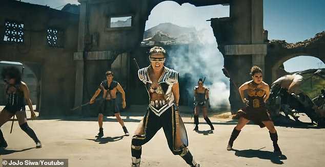 The Dance Moms star, 21, started the new year strong and released the music video on Wednesday. He prepared for combat and fought all of his exes at the same time in a video game-inspired showdown.