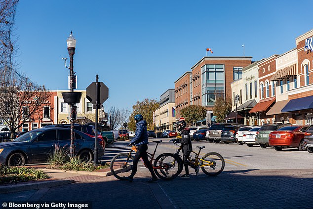 Bentonville in northwest Arkansas (pictured), which is home to Walmart's headquarters, is seeing a particular influx of newcomers.