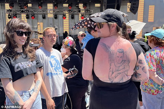 Fed Square quickly reached capacity as fans scrambled to secure a spot at the concert, with hundreds of people lounging on blankets on top of a hill above the river.