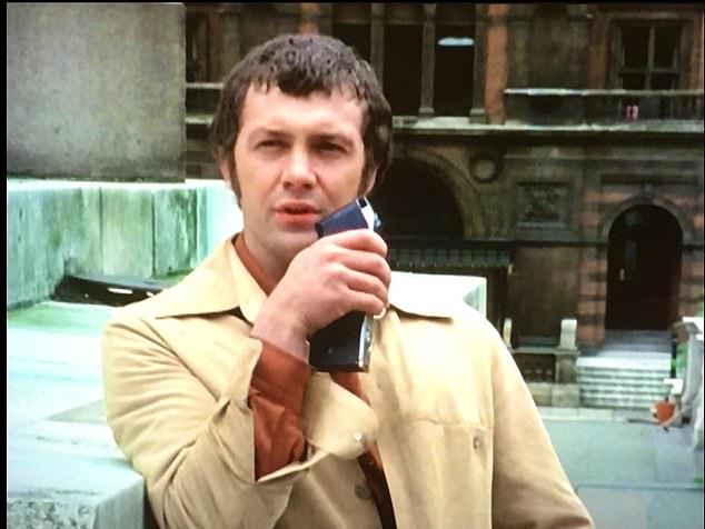 Lewis Collins using a walkie talkie in the 1970s television series The Professionals