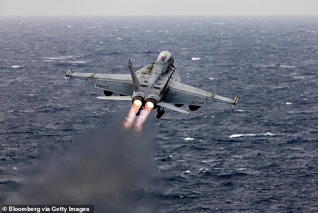 An F/A-18 Super Hornet fighter jet takes off from the flight deck of the aircraft carrier USS Dwight D. Eisenhower (CVN 69) during operations in the southern Red Sea, on Tuesday, March 19, 2024