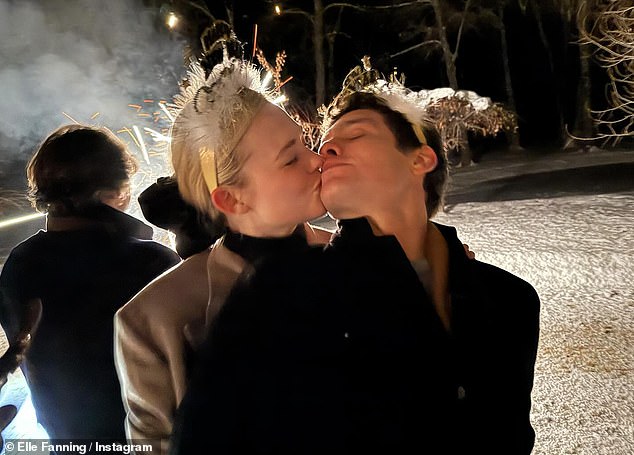 The Maleficent star, 26, and her Rolling Stone CEO boyfriend, 34, looked loved-up as she planted kisses on him.