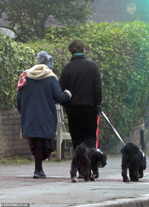 Arm in arm, the couple enjoyed a romantic morning walk.