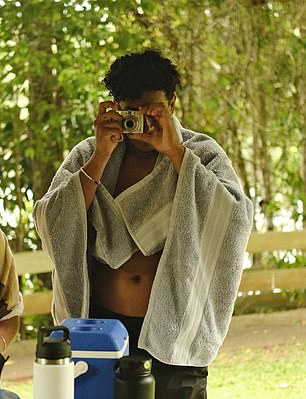 Francisco was seen taking a photo during the family outing