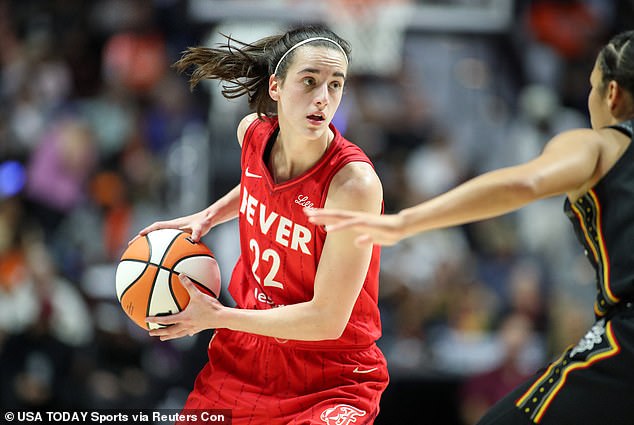 Indiana Fever guard Caitlin Clark (22) owns the ball in her first playoff series