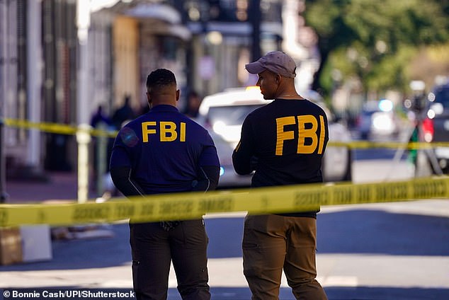 FBI agents at the scene of the early morning New Year's attack on revelers and workers late in Bourbon Street, New Orleans' famous party district