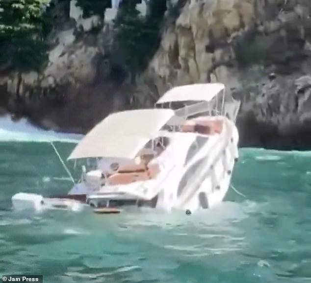 The empty yacht could later be seen in images almost vertical as it sank into the blue waters.