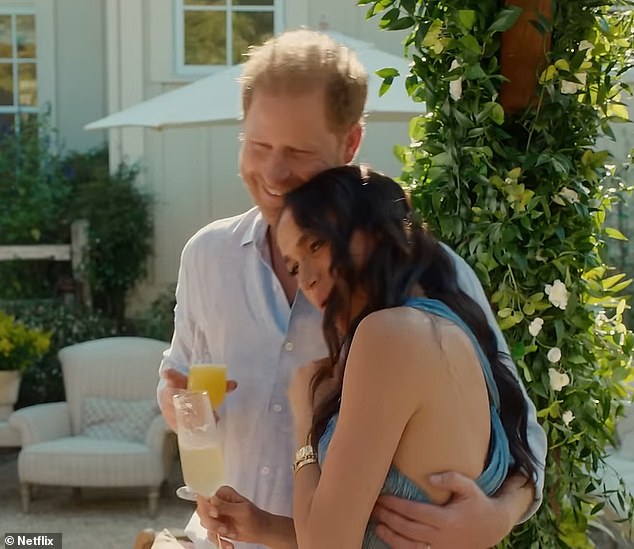 The clip shows Prince Harry and Meghan Markle sharing a sweet moment while each enjoying a drink.