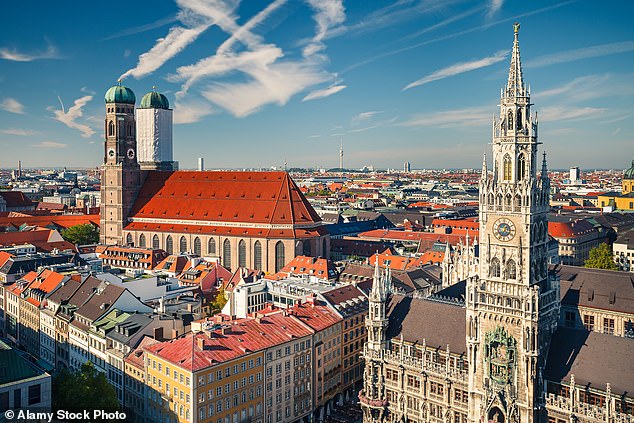 The image shows an aerial view of Munich. The Munich judge's decision to sentence Thomas B, 28, to 11 months' probation has sparked outrage in Germany