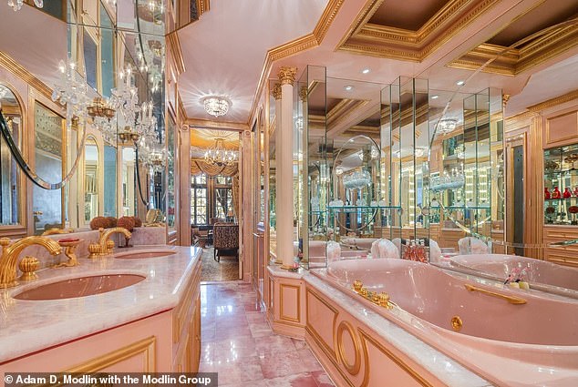 Ivana's master bathroom includes pastel pink sinks, pink marble floors, and of course, gold accents.