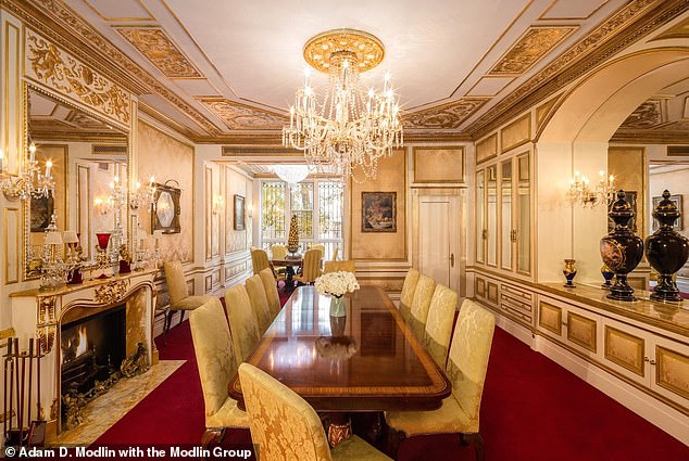 The Versailles-inspired dining room features a floor-to-ceiling window that overlooks the private interior courtyard.