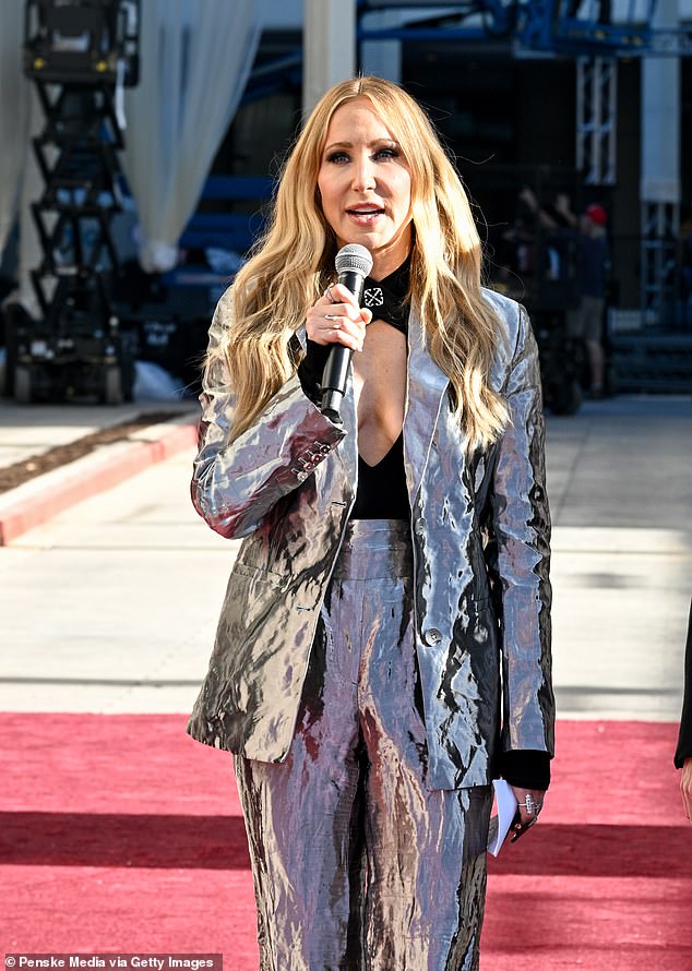 She added a touch of sparkle with high-waisted metallic pants and a matching jacket, teamed with pointed-toe heels.