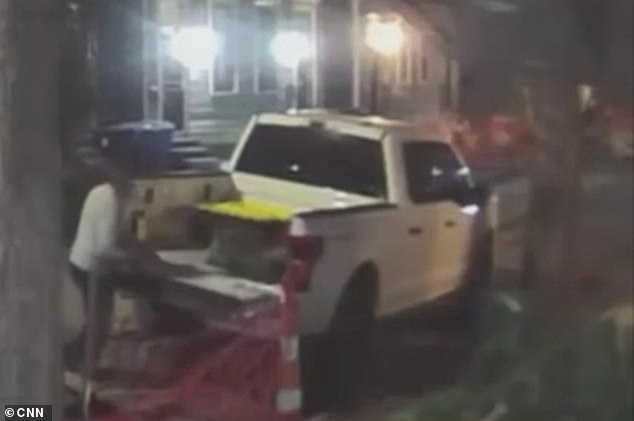 Footage showed Jabbar lifting boxes from the truck's bed and carrying them inside from the curbside parking lot.