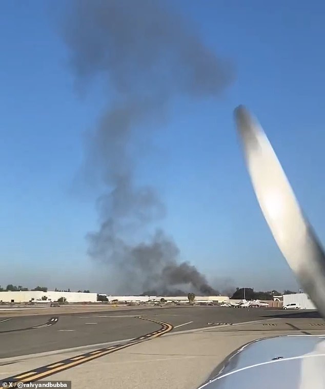 A plume of thick black smoke rose into the air above the scene and was visible for miles