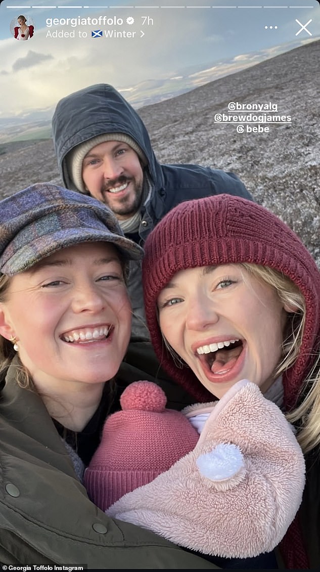 Georgia and James, who is from Aberdeenshire, were also seen attending the Cluny Carols at Cluny Castle in December (pictured with Cosmo's wife Bronya).