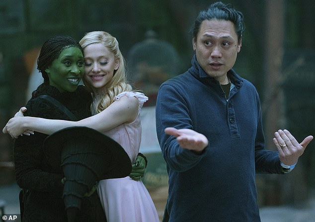 The couple is enjoying the box office success of Wicked: Part 1, the first installment of the two-film adaptation of the hit 2003 musical; photographed on set with director Jon M. Chu