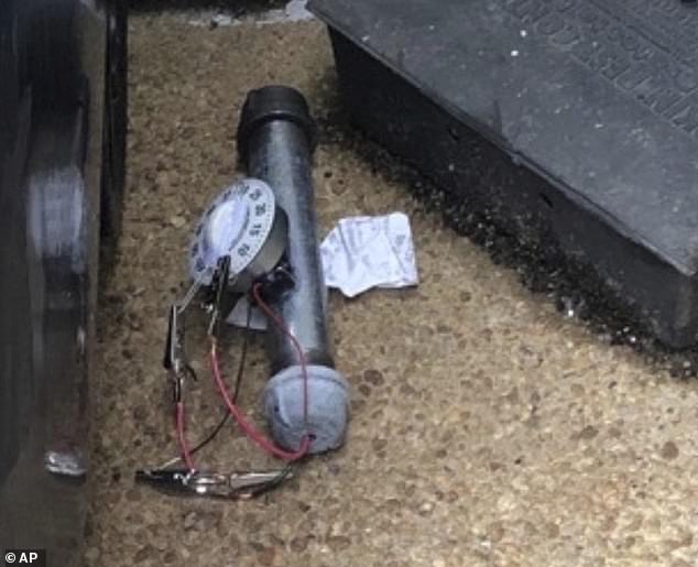 An explosive device is shown outside the Republican National Committee office, Wednesday, Jan. 6, 2021, in Washington