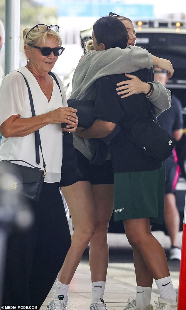 Kerr is pictured being comforted by his fiancee Kristie Mewis before flying to Western Australia