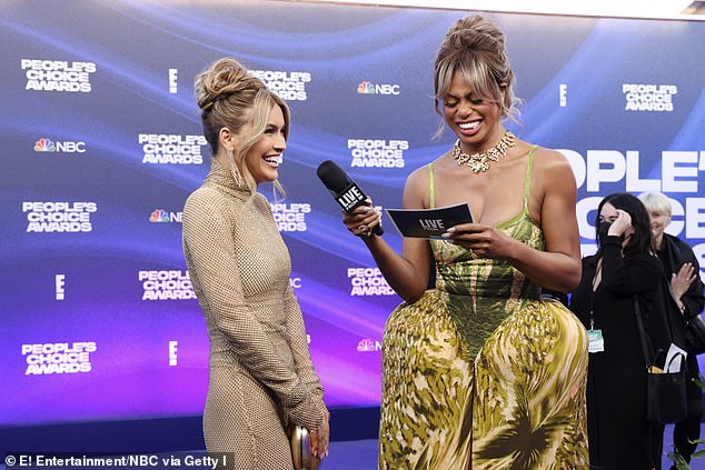 Cox has hosted E! News' red carpet coverage of the Golden Globes, Oscars, Emmys and other major Hollywood events since joining the network in January 2022; Cox seen interviewing Chrishell Stause in 2022