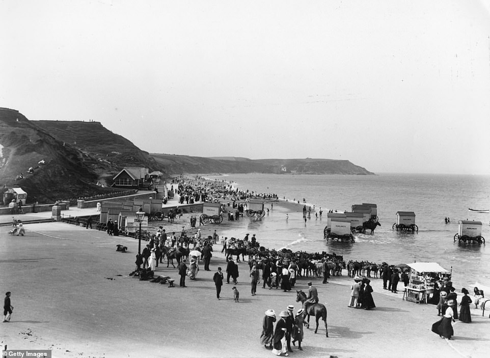 Tourists on North Beach in Scarborough in 1913. Tourists at the time could make use of wheeled bathing machines, a type of modest device that granted private access to the water.