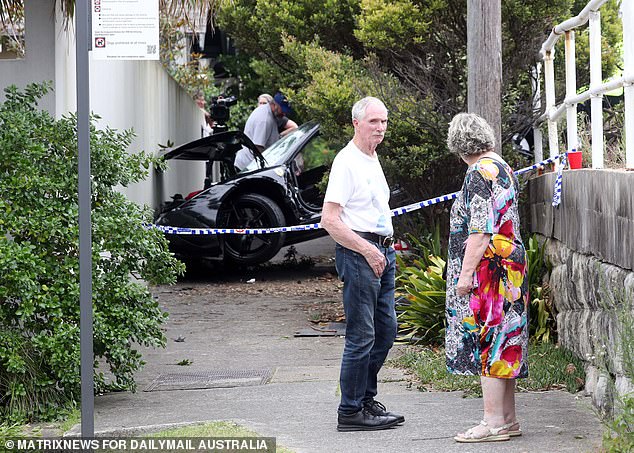 Locals were seen milling around the accident site on Thursday afternoon.