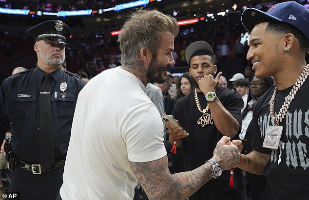 The soccer star was then seen shaking hands with other attendees at the game.