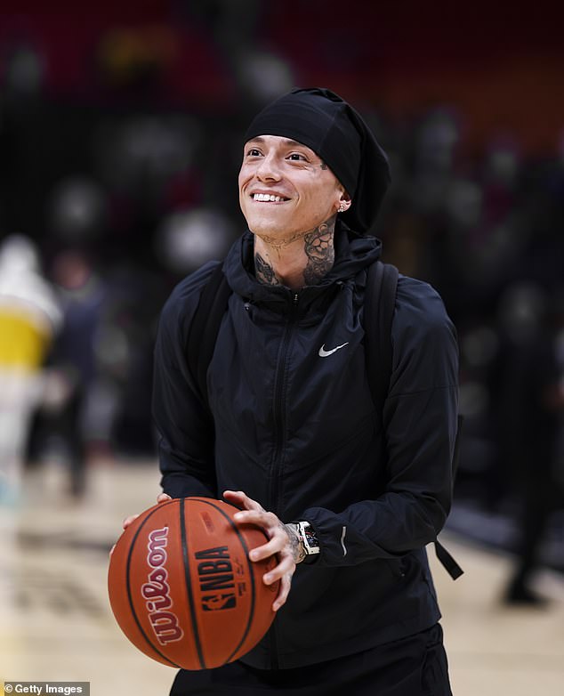 The tattooed hitmaker, 26, looked in high spirits as he shot some hoops after the match.