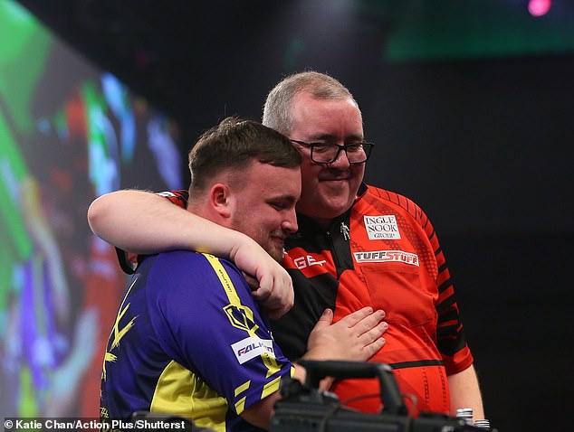 Littler regularly hugged Stephen Bunting (right) during their magnificent 6-1 semi-final victory.