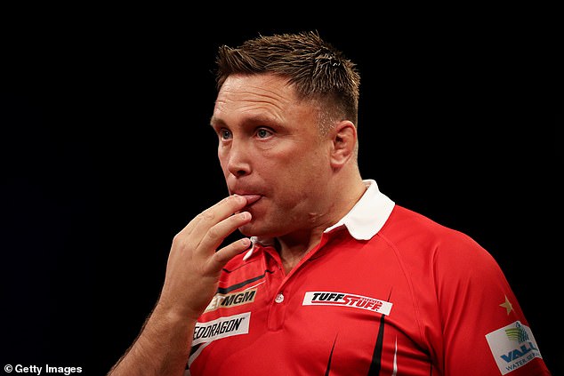 Gerwyn Price (pictured February 2024) is known to lick her fingers to help with friction and grip.