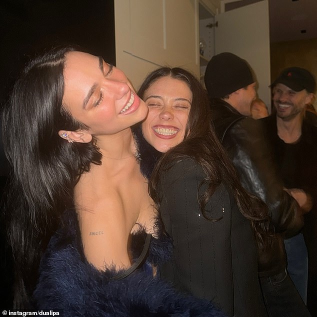 Dua looked radiant as she snuggled up with her friends at the New Year's Eve party.