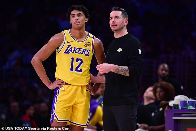 Lakers head coach JJ Redick speaks with guard Max Christie on Tuesday in Los Angeles.