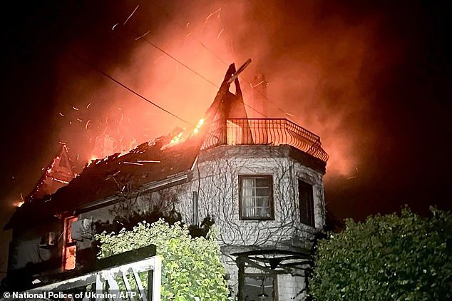 This photograph taken and released by the National Police of Ukraine on November 29, 2024 shows a house on fire following a drone strike at an undisclosed location in the Odessa region.