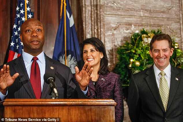 Scott speaks at the South Carolina Statehouse after being introduced by then-Governor Nikki Haley (center), who appointed him to fill the seat vacated by retiring Senator Jim DeMint