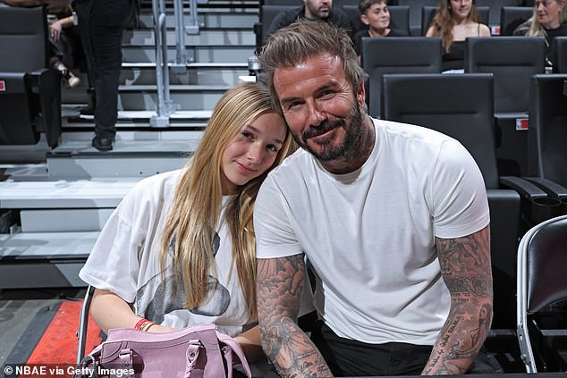 Dad David was also sitting courtside with his daughter Harper, 13, and the couple posed together for a sweet photo.