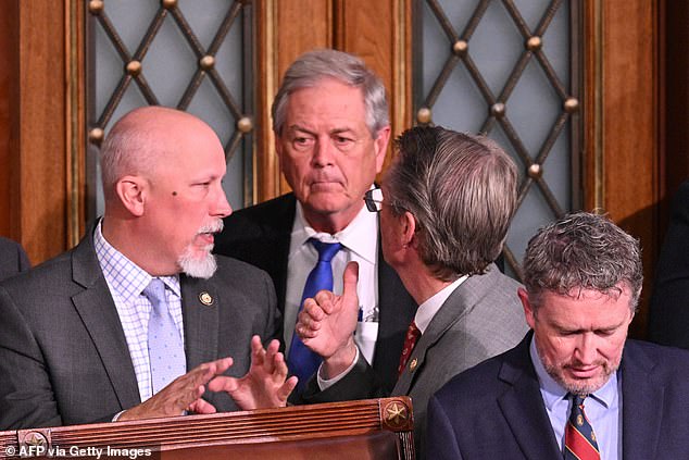 Representatives Chip Roy, Republican of Texas, Ralph Norman, Republican of South Carolina, and Tim Burchett, Republican of Tennessee, speak as Thomas Massie, Republican of Kentucky, looks on during the vote for Speaker of the House of Representatives on the first day of the 119th Congress in the House Chamber of the U.S. Capitol in Washington, DC, on January 3, 2025. Massie and Norman voted against Johnson