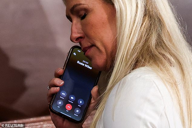 U.S. Rep. Marjorie Taylor Greene (R-GA) speaks on the phone with new Chief of Staff Susie Wiles as representatives gather to vote for the new Speaker of the House of Representatives on the first day of the 119th Congress at the U.S. Capitol in Washington, USA , January 3, 2025