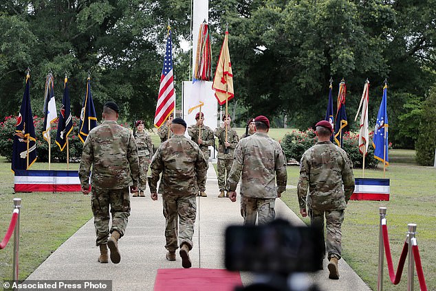 Commanding officers approach the color guard during a Fort Bragg renaming ceremony