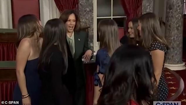 Dave McCromick, a Republican from Pennsylvania, brought his daughters to Harris' swearing-in ceremony. After the five girls pose for a photo with Harris and without McCormick, one of them is seen whispering to Harris, 