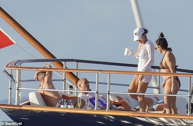 Lauren was seen joining him at some point, as they sat comfortably with cups of coffee in the huge container. Champagne glasses could also be seen on the yacht.