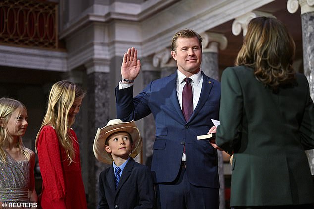 Senator Tim Sheehy's son watches in a cowboy hat as the vice president takes the oath of office for Montana's junior senator