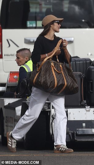 She carried her essentials in a Louis Vuitton canvas bag as she showed off her designer taste.