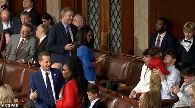 CSPAN cameras captured the Boebert family at the back of the House chamber on Friday