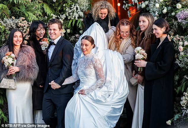 The bride, Ella Victoria Malone, 26, looked stunning as she donned a classic white dress with a full skirt and lace sleeves.