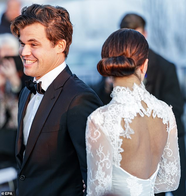 SMILE: Chess Grandmaster Magnus Carlsen was seen smiling while standing next to his new wife.