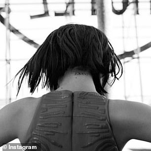 Selena Gomez has 'LXXVI', which is '1976' written in Roman numerals, on the back of her neck.