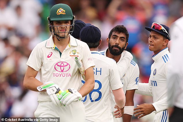 The Indian team surrounded the youngster after claiming the wicket of Usman Khawaja to end the opening day of the Test.