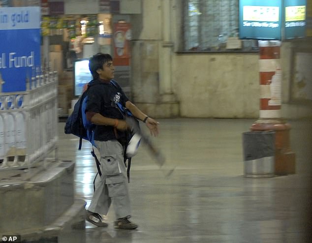 Terrorists, including Ajmal Kasab (pictured, who has since been executed), bombed and shot more than 170 people, coordinating their activities with satellite phones.