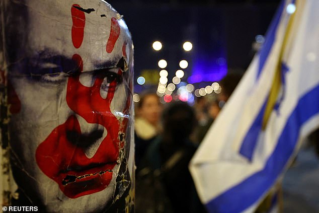 An anti-Netanyahu poster taped to a Tel Aviv lamppost by a protester this afternoon