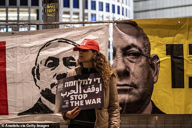 An anti-war protester wearing a cap that said 